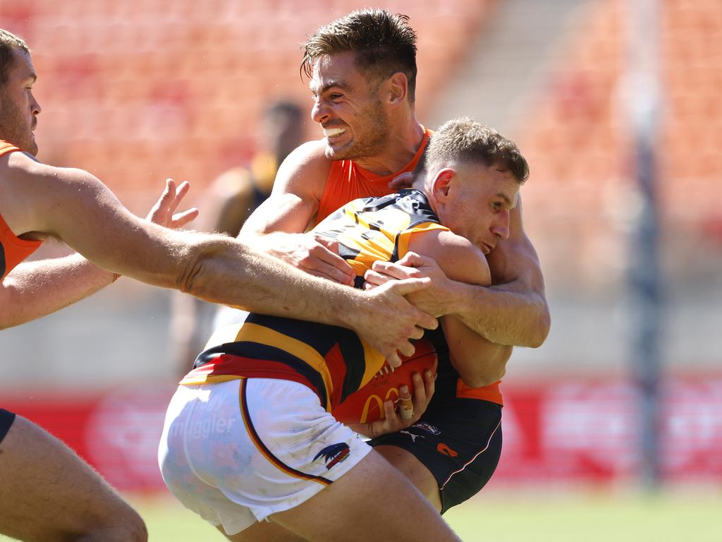 Stephen Coniglio wraps up Rory Laird. Picture: Phil Hillyard