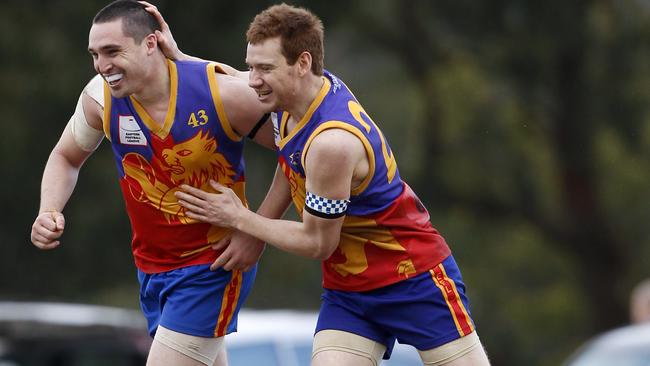 Adam Booth (L) celebrates a goal during the 2010 Division 2 grand final.