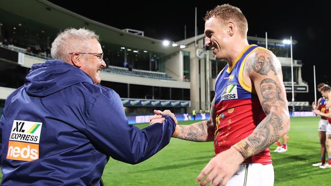 Mitch Robinson and coach Chris Fagan celebrate victory in the coach’s 100th at the helm. Picture: Getty Images