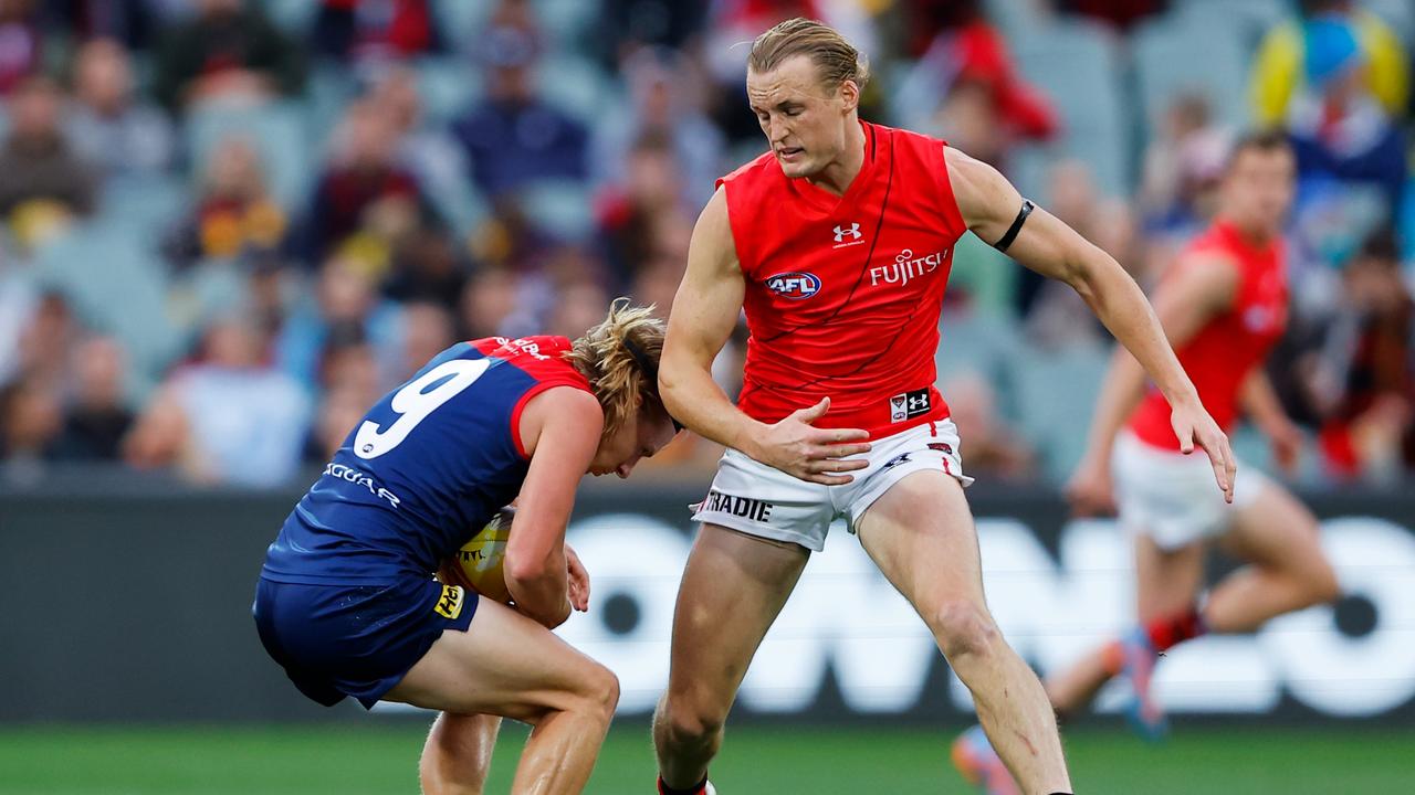 Melbourne’s Charlie Spargo was subbed out after this collision with Bomber Mason Redman. Picture: Dylan Burns/AFL Photos