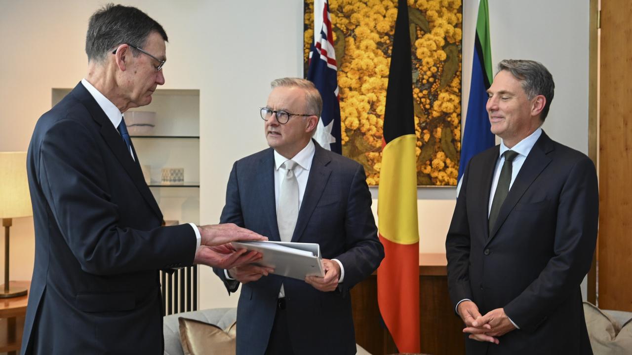 Sir Angus Houston delivers the Defence Strategic Review 2023 to Prime Minister Anthony Albanese and Deputy PM and Minister of Defence Richard Marles at Parliament House on February 14, 2023 in Canberra, Australia. Picture: Getty Images