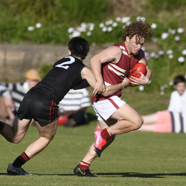 Darcy McKenny makes a tackle as a schoolboy in South Australia. Picture: Naomi Jellicoe