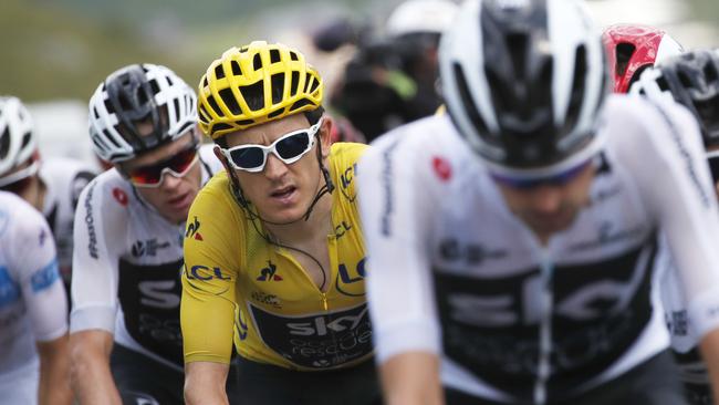 Britain's Chris Froome, second left, follows teammate Britain's Geraint Thomas, wearing the overall leader's yellow jersey, as they climb Col du Tourmalet pass during the nineteenth stage of the Tour de France cycling race over 200.5 kilometers (124.6 miles) with start in Lourdes and finish in Laruns, France, Friday July 27, 2018. (AP Photo/Christophe Ena )