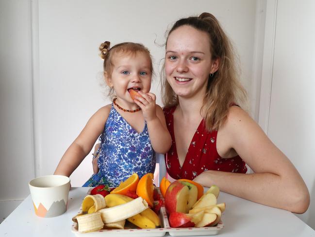 Aria Jones and mum Lauren David enjoy some  fruit. Picture:  Liam Kidston