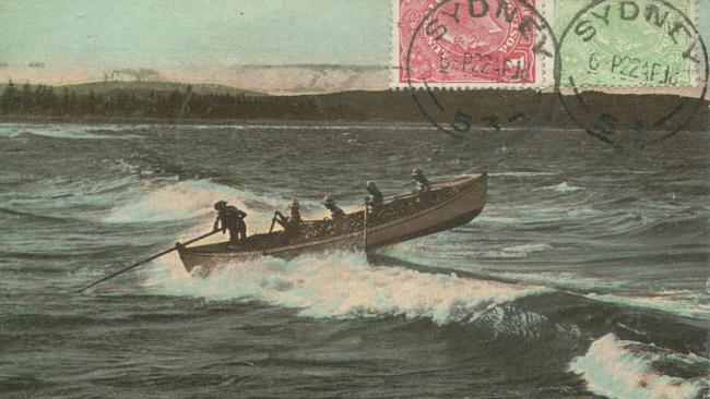 A postcard showing the Sly family taking Manly Council's surfboat out through the waves. Picture Northern Beaches Library