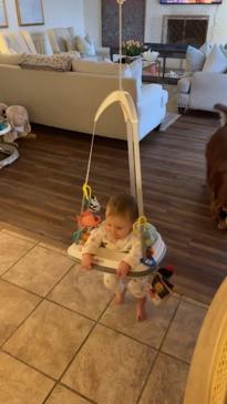 Baby has time of her life bouncing in harness