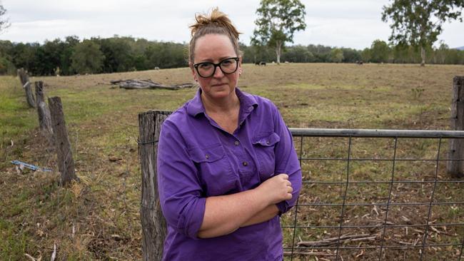 Widgee cattle farmer Kris Janke stands outside the gate of the paddock of one of the proposed transmission line routes. Picture: Christine Schindler