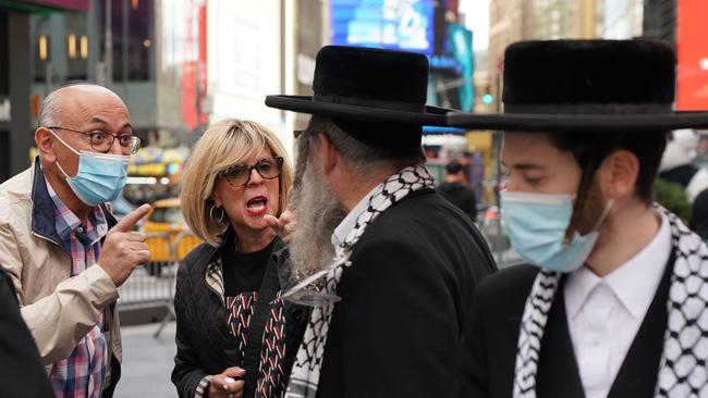 People argue during a protest to show solidarity with Israel by the Israeli-American Council (IAC) and other American Jewish groups and a counter-protest by the Hasidic Jewish community members in Times Square. Picture: AFP