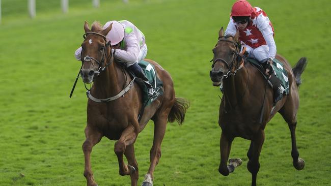 YORK, ENGLAND - AUGUST 23: William Buick riding Vauban (pink/green spots) win The Weatherbys Hamilton Lonsdale Cup Stakes at York Racecourse on August 23, 2024 in York, England. (Photo by Alan Crowhurst/Getty Images)