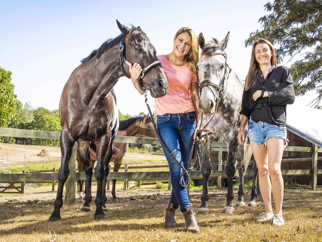 Injured jockey Tegan Harrison (right) and Liz Cantor (pink top) with retired race horses Latin American (dark horse on the left) and Catch Jack. Tegan had a fall and Liz has been exercising the horses while Tegan recovers. Picture: NIGEL HALLETT