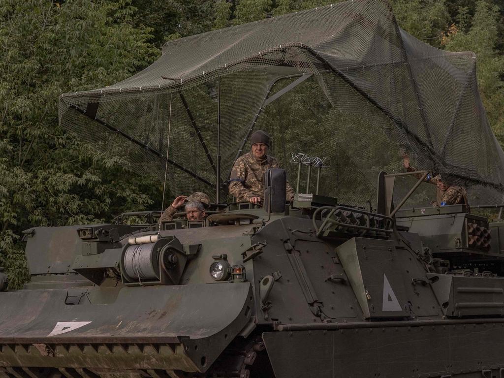 Ukrainian servicemen operate an armoured military vehicle in the Sumy region, near the border with Russia. Picture: AFP