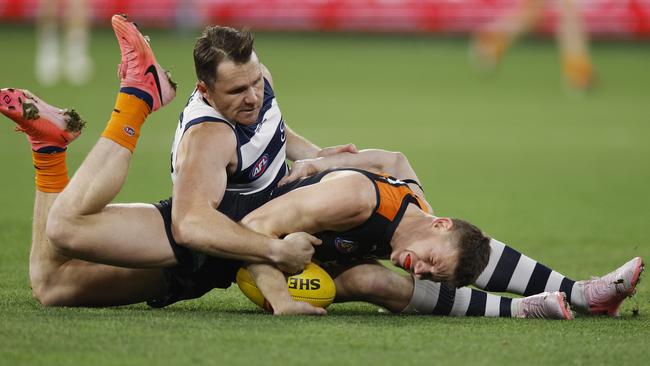 MELBOURNE, AUSTRALIAÃ&#137; June 21, 2024. AFL Round 15. Carlton vs Geelong at the MCG. Sam Walsh of the Blues gets tackled into the turf by Patrick Dangerfield of the Cats during the 1st qtr. . Pic: Michael Klein