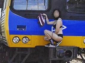 Half-naked teen seen train surfing