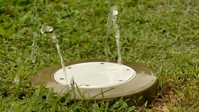 Leanne Dobbin is one of many Wulguru residents that experiences poonami when the rain comes. A fountain of sewage in her backyard. Picture: Evan Morgan