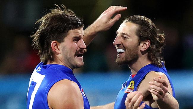 Western Bulldogs Josh Bruce celebrates kicking a goal with Marcus Bontempelli during AFL match between the Sydney Swans and Western Bulldogs at the SCG. Picture. Phil Hillyard