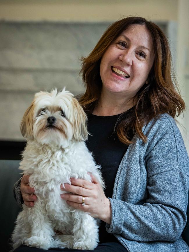 Maria Capone and her life saving dog, Patrick at their home in Toorak Gardens. Picture: Tom Huntley