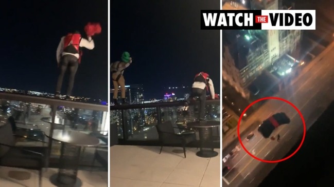 Shocking moment men jump from hotel roof