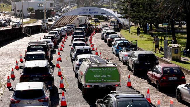 Cars queue at the Bondi Beach drive through Covid-19 testing site. Picture: Damian Shaw