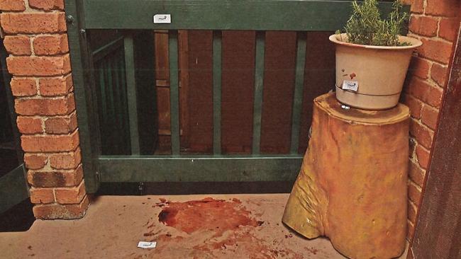 The bloody crime scene on the front porch at Mr Caposiena's Westmeadows home.