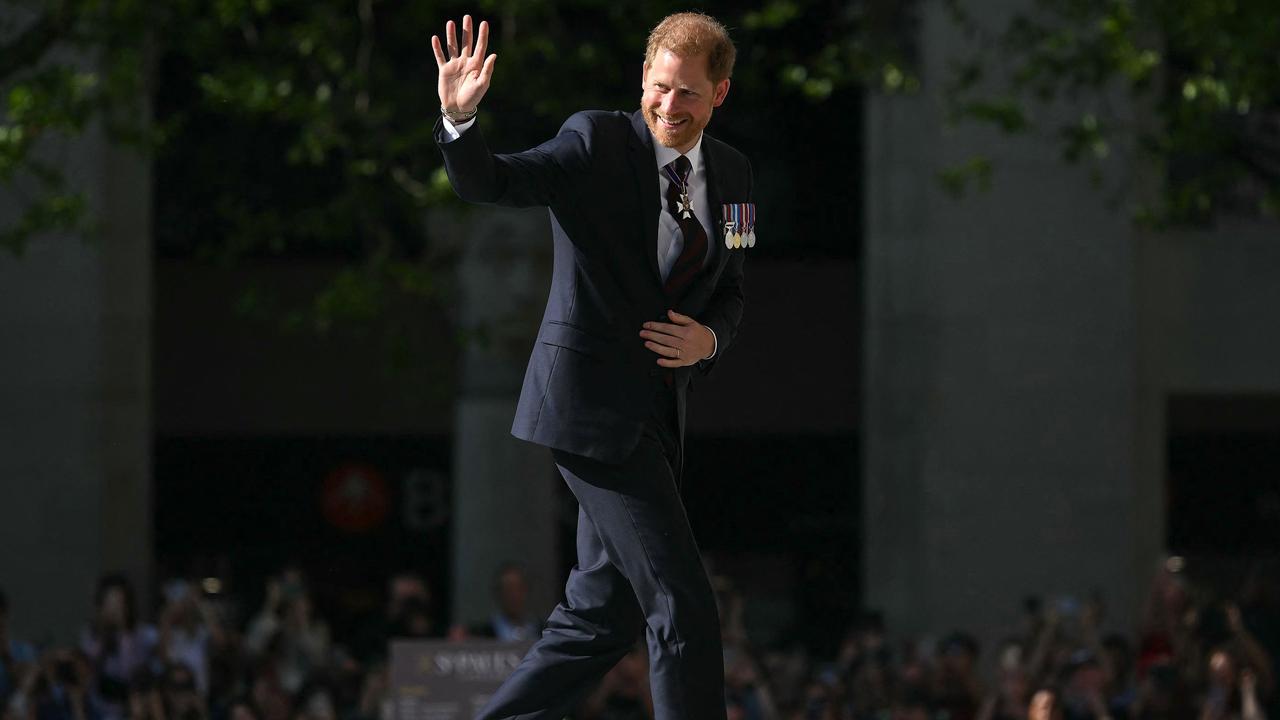 Britain's Prince Harry, Duke of Sussex waves as he arrives to attend a ceremony marking the 10th anniversary of the Invictus Games, at St Paul's Cathedral in central London, on May 8, 2024. (Photo by JUSTIN TALLIS / AFP)