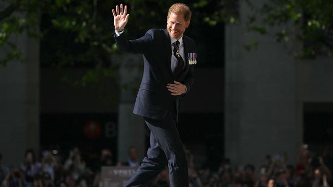 Britain's Prince Harry, Duke of Sussex waves as he arrives to attend a ceremony marking the 10th anniversary of the Invictus Games, at St Paul's Cathedral in central London, on May 8, 2024. (Photo by JUSTIN TALLIS / AFP)