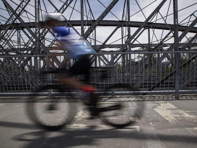 Cyclist seen on pedestrian and bicycle bridge. Generic Indooroopilly Cycle Bridge. Crn of Railway Ave & Lambert St, Indooroopilly, Brisbane, 18th of October 2020. (News Corp/Attila Csaszar)