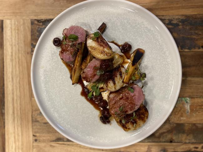 Pan roasted duck honey roasted parsnips, grilled plum, whipped feta, cherry jus. Picture: Supplied.