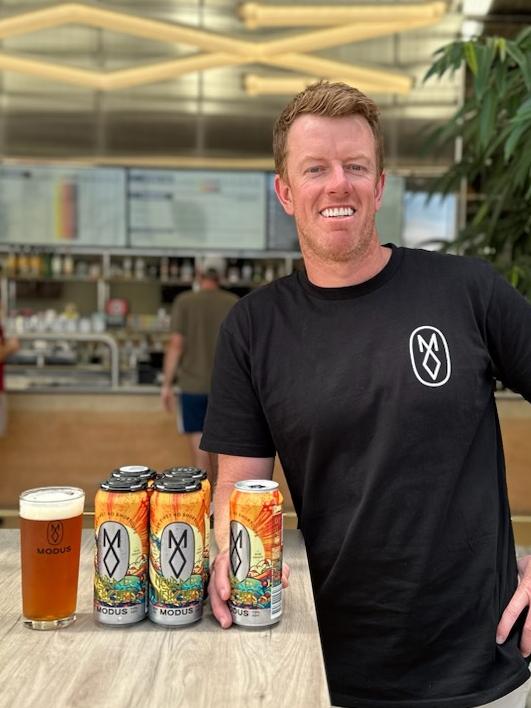 Modus Brewing founder Grant Wearin with ‘Neural Network’, the world's first AI generated beer . Supplied.