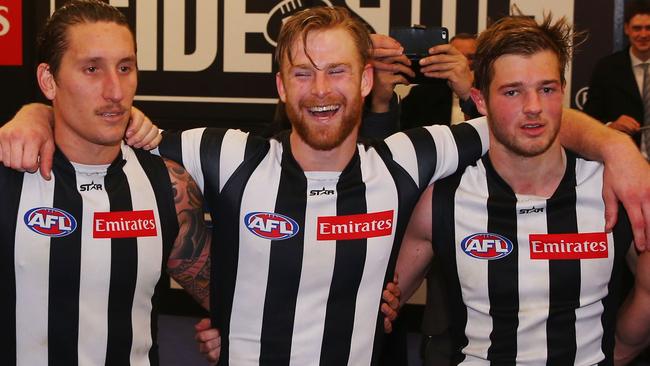 Jonathon Marsh (centre) celebrates a win with Jesse White and Rupert Wills.