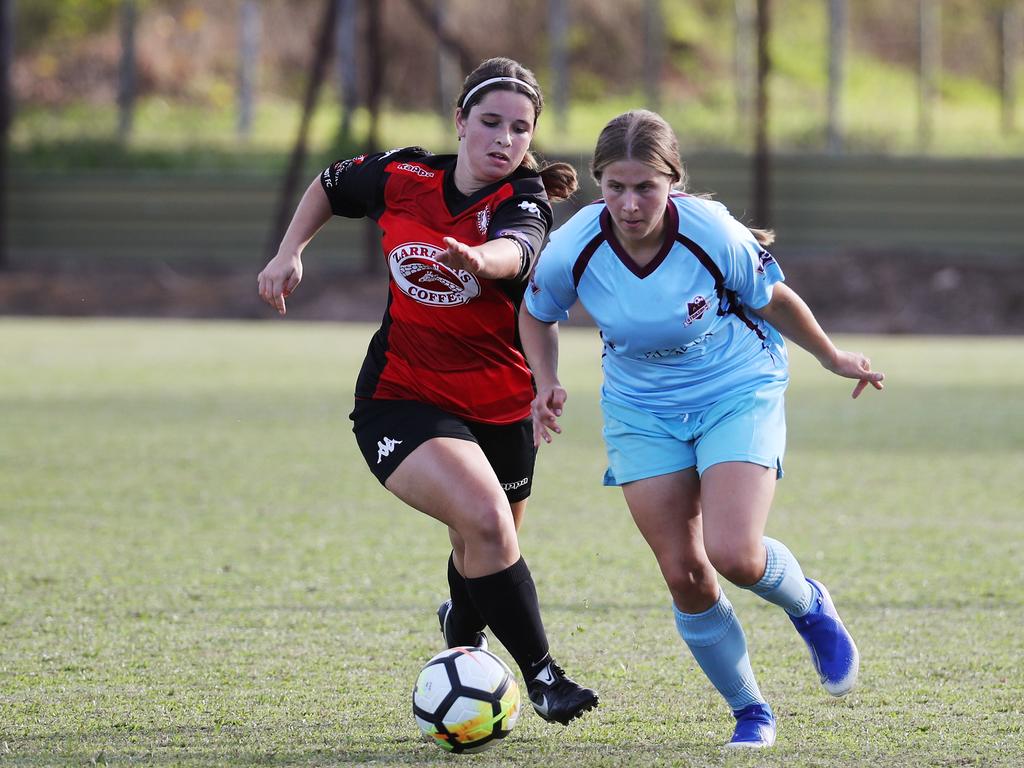 Lions' Michaela Noremberczyk and Striker's Morgan Stanton. PICTURE: BRENDAN RADKE