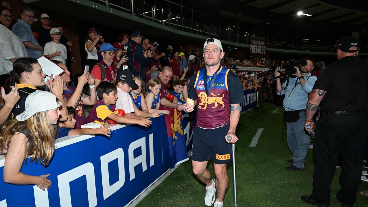 IPSWICH, AUSTRALIA - SEPTEMBER 29: Lachie Neale celebrates with fans at Brighton Homes Arena, on September 29, 2024, in Ipswich, Australia. The Brisbane Lions won the 2024 AFL Grand Final yesterday beating Sydney Swans at the MCG. (Photo by Bradley Kanaris/Getty Images)