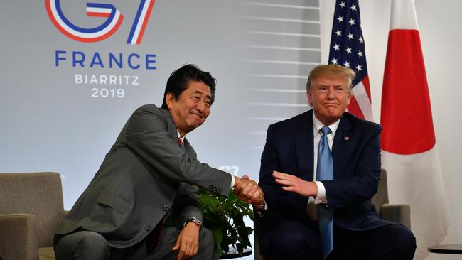 Donald Trump and Shinzo Abe shake hands during a bilateral meeting in Biarritz, south-west France, at the G7 Summit in 2019. Picture: AFP