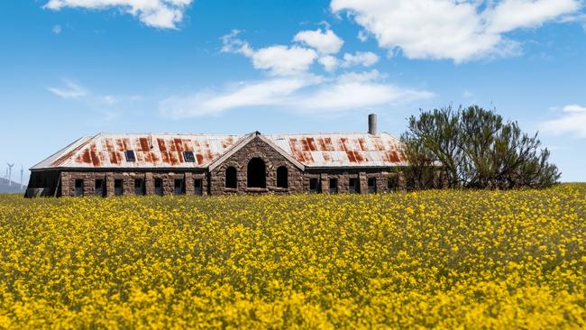 A historic bluestone shearing shed stands at the Dean family’s Eurambeen Station.