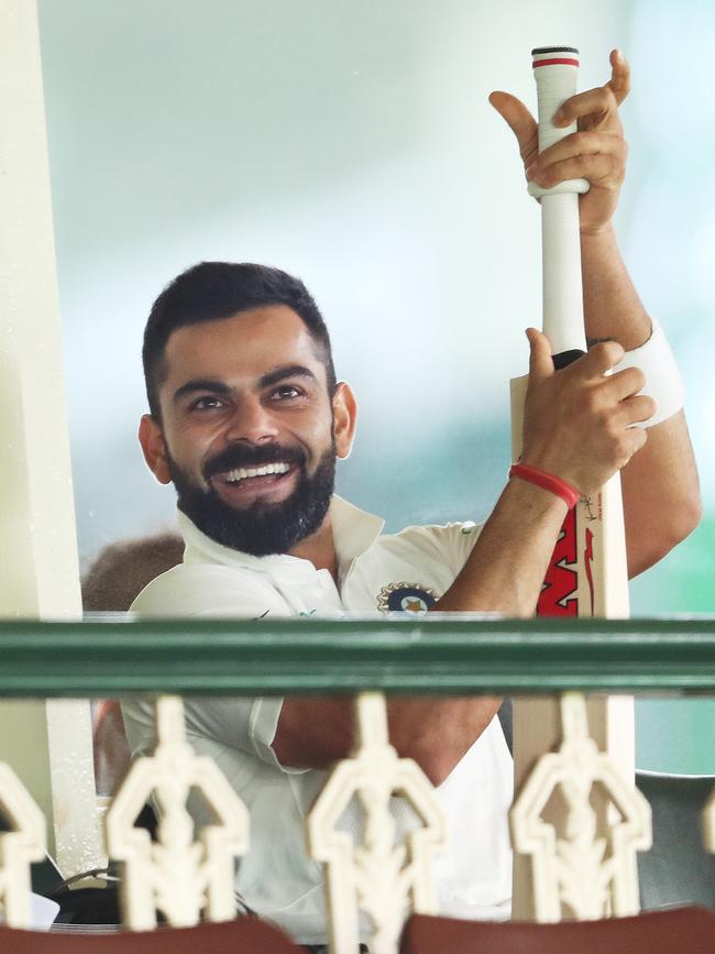 India's Virat Kohli regrips his bat. Picture: Phil Hillyard