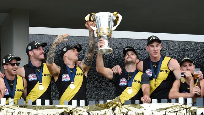 Dustin Martin and Trent Cotchin hold the Premiership Cup aloft