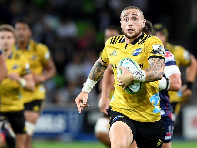 TJ Perenara of the Hurricanes runs with the ball during the Round 7 Super Rugby match between the Melbourne Rebels and the Hurricanes at AAMI Park in Melbourne, Friday, March 30, 2018. (AAP Image/Joe Castro) NO ARCHIVING, EDITORIAL USE ONLY