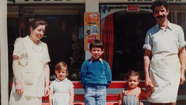 Murder victim Mersina Halvagis, aged 4, with parents Christina and George, brother Nick and sister Dimitria outside their shop in Warracknabeal shop in 1976.