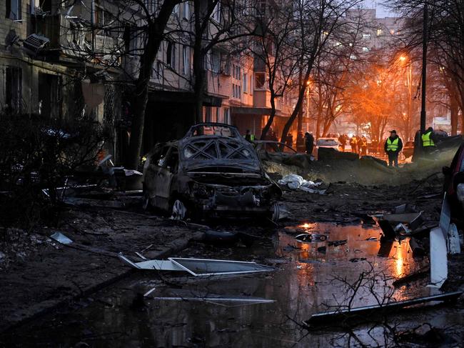 Destroyed cars next to a damaged residential building following a missile strike in Kyiv, amid Russian invasion of Ukraine. Picture: AFP