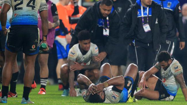 Fiji's players were devastated after almost producing a classic World Cup upset. Picture: AFP.