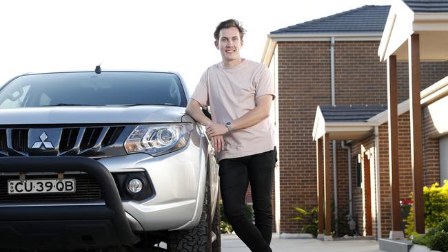 Sam Rawlings, 28, from West Ryde recently purchased a used Mitsubishi Triton Ute. Picture: Jonathan Ng