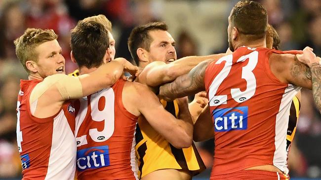 Lance Franklin (right) clashes with former teammate Luke Hodge. Picture: Getty Images