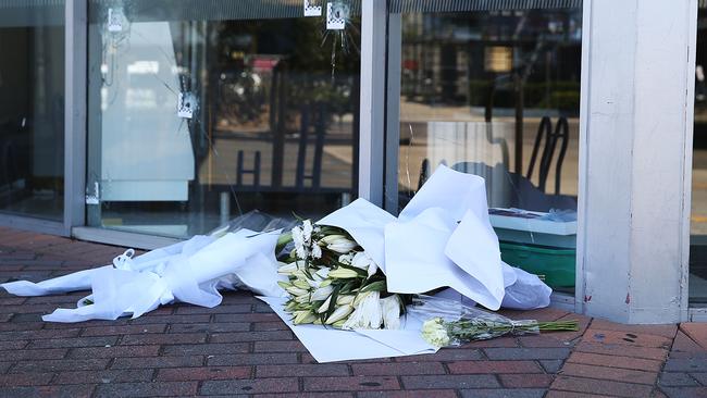 Flowers at the front of Fitness First, Rockdale, where Mick Hawi was shot and later died on Thursday.