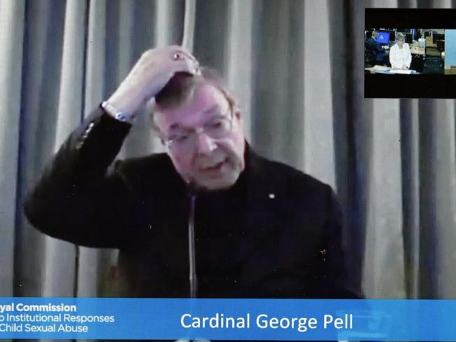 Cardinal George Pell is seen on a screen as he gives evidence to the Royal Comission into Institutional Responses to Child Sexual Abuse via video link from Rome. Picture: AAP / Lukas Coch