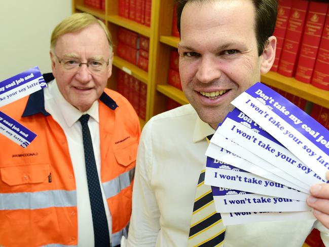 (front) Senator Matt Canavan, Minister for Resources and Northern Australia and Senator Ian Macdonald with the 'Don't take my coal job' stickers.