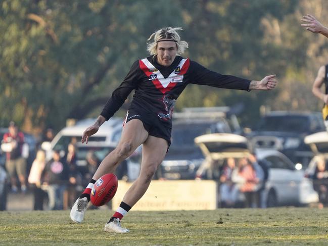 Brady O’Toole takes a kick for Devon Meadows. Picture: Valeriu Campan