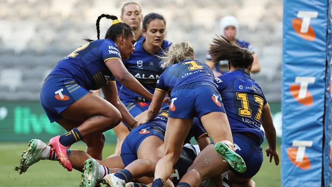 Not even five defenders could stop Amber Hall from scoring a try earlier this year. Picture: Jeremy Ng/Getty Images