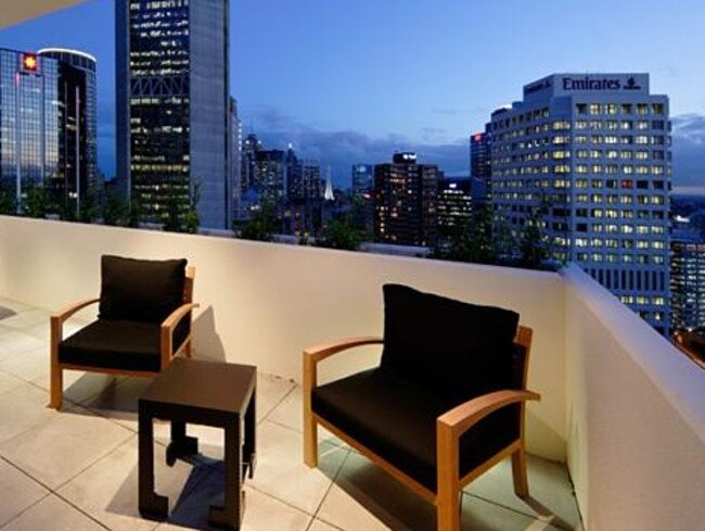 An entertaining area looks out over the Sydney CBD.