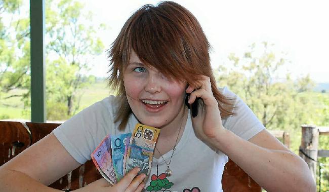 Lauren Yuile, 15 years, is the youngest member of the family with a mobile phone which she thinks saves money.