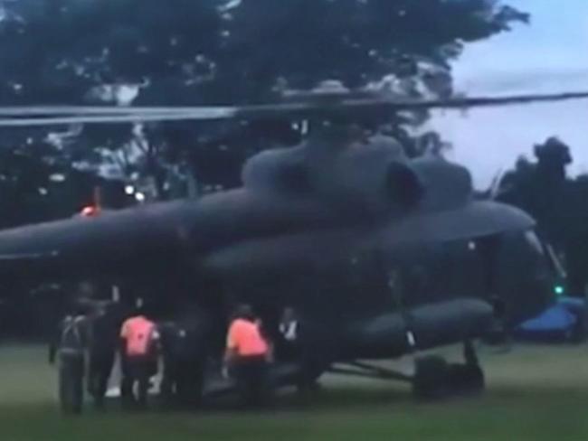 The freed boys are placed onto a helicopter for a trip to hospital. Picture: Thai TV
