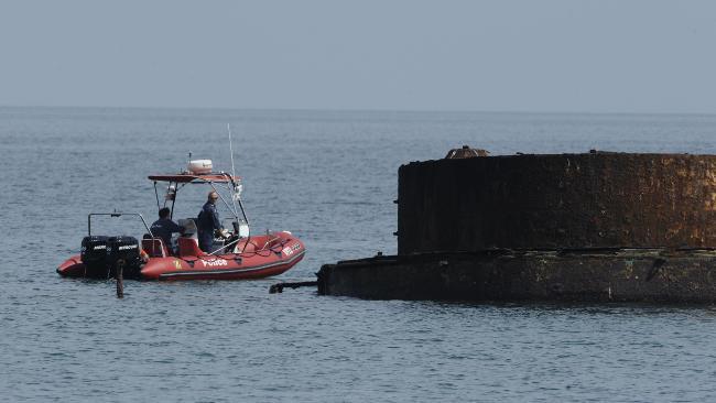 <b>Body discovered:</b> Water police search around the HMS Cerberus at Half Moon Bay for a missing snorkeller in February. Picture: Chris Eastman, Leader Newspapers